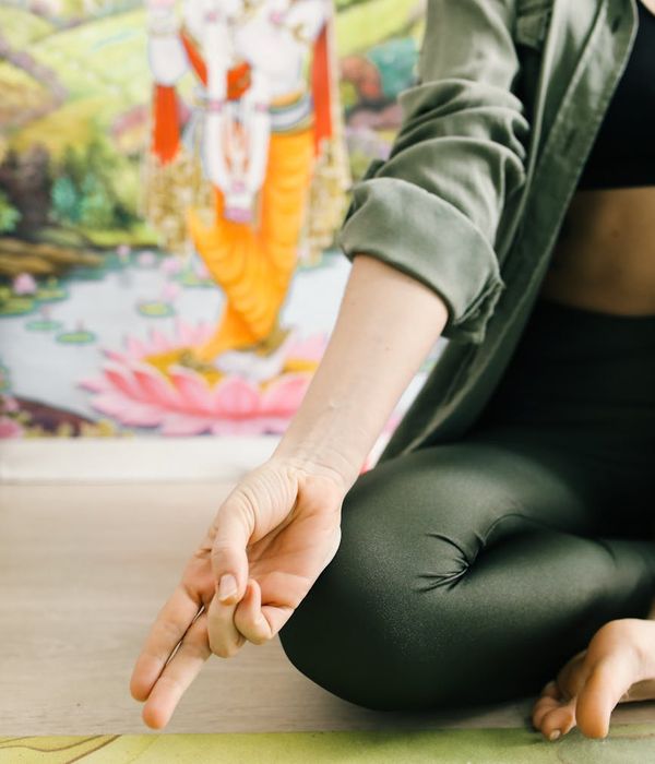 Woman in a calm yoga pose, embodying balance and inner peace.